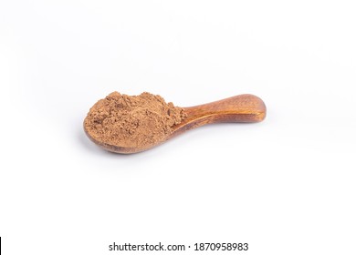 Studio Lighting. Allspice On A Wooden Spoon, On A White Background. There Is A Shadow. Close-up. No Isolation