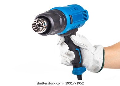 Studio Lighting. On A White Background. Industrial Hair Dryer. A Human Hand In A Leather Glove