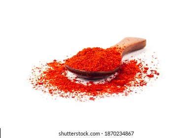 Studio Lighting. Red Paprika Spice On A Wooden Spoon, On A White Background. There Is A Shadow. Close-up. No Isolation