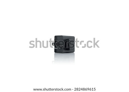 Studio macro close up of black motorcycle turn signal flasher relay featuring durable plastic housing, metal blade pin terminals, rubber mounting strap bracket, side perspective view, isolated on pure white background with soft mirror reflection.
