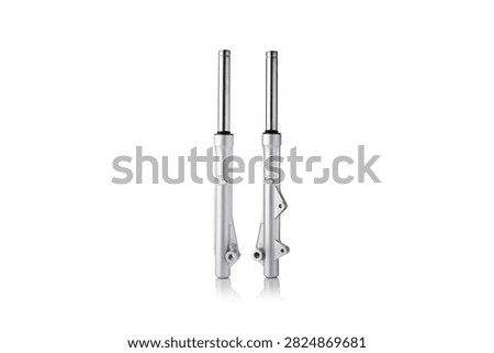 Studio macro close up of pair of front motorcycle suspension fork legs featuring polished chrome stanchion tubes, durable silver metallic painted lower sliders, mounting caliper brackets, vertical parallel alignment, and soft mirror reflection, isolated on pure white background for auto parts mockup.