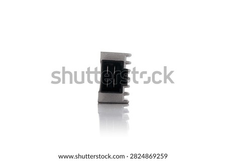 Studio macro front perspective view of motorcycle voltage regulator rectifier unit featuring black plastic terminal socket connector, four pin contacts, cast aluminum heat sink body, soft bottom mirror reflection, isolated on clean white background for vehicle electrical system repair.