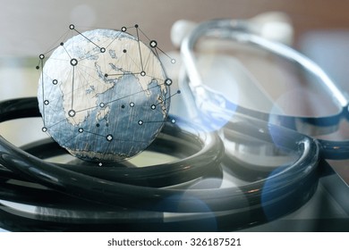 Studio macro of a stethoscope and texture globe with digital tablet as medical network concept