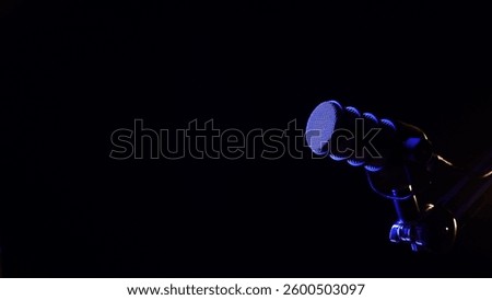 Studio microphone with dramatic blue lighting