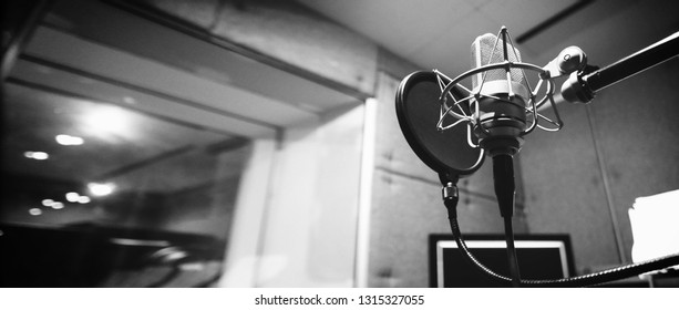 Studio Microphone Or Mic For Recording For Vocal Singer Or Commercial Announcer With Shock Mount And Pop Filter On Professional Tripod In Acoustic Foam Room For Best Sound And Mix Process