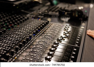 Studio mixing control surface allows controlling the digital audio workstations (DAW). Selective focus.