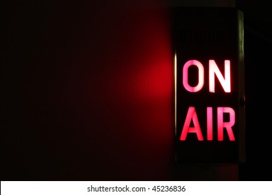 Studio On Air sign illuminated with glowing copy space