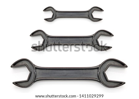 A studio photo of an adjustable spanner