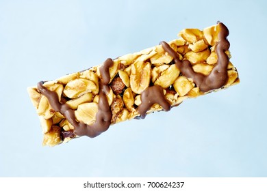 A Studio Photo Of A Choc Coated Nut Bar