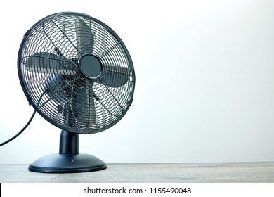 A studio photo of an electric cooling fan