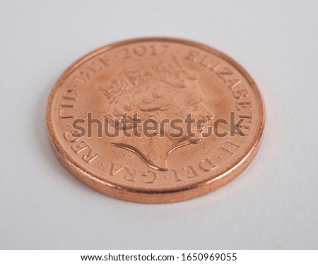 A studio photo of an English penny coin