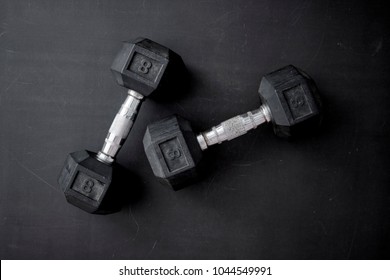 A Studio Photo Of Gym Dumbells