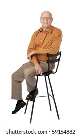 Studio Photo Of Happy, Mature Man Seated On Black Stool. White Background.