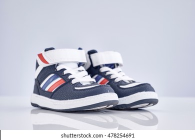 A Studio Photo Of Kids Shoes                               