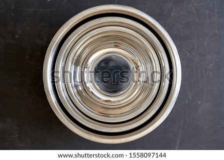 empty old soup plate with spoon on old wooden background