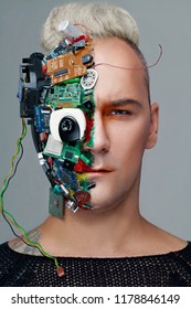 Studio Photo Of Man Cyborg, Half Face Computer Elements And With Professional Make-up, White Iroquois On Head. Future Technology Concept