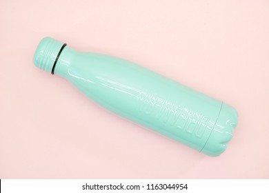 a studio photo of a metal water bottle