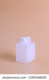 Studio Photo Mock Up Blank Plastic White Canister. Mockup For Brand And Package Design