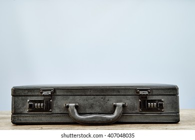 A Studio Photo Of An Old Leather Briefcase