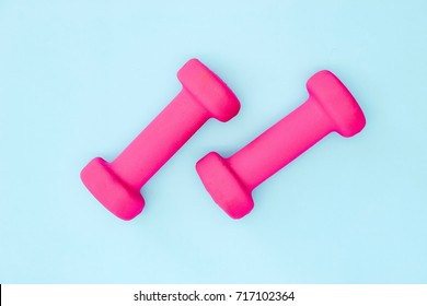 A Studio Photo Of Pink Dumbells