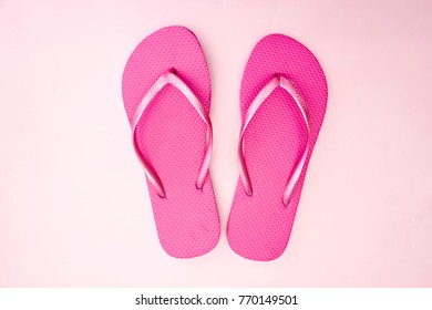 A Studio Photo Of Pink Flip Flops