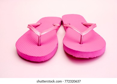 A Studio Photo Of Pink Flip Flops