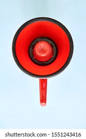 A Studio Photo Of A Red Mega Phone