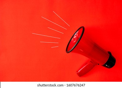 A Studio Photo Of A Red Mega Phone