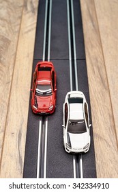 A Studio Photo Of A Slot Car Race Set