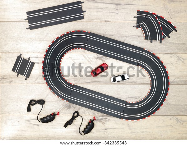 A studio photo of a\
slot car race set