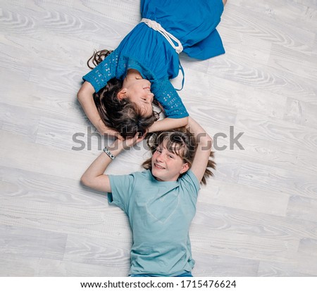 Similar – Image, Stock Photo Relaxed mother and sons playing over the bed