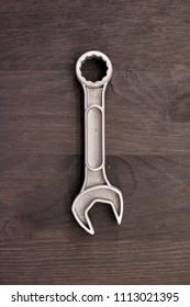 A Studio Photo Of A Wrench On An Oily Rag