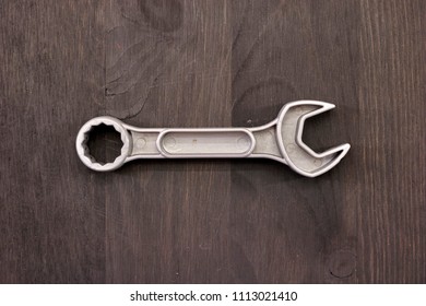 A Studio Photo Of A Wrench On An Oily Rag