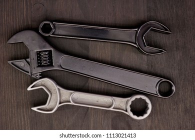 A Studio Photo Of A Wrench On An Oily Rag