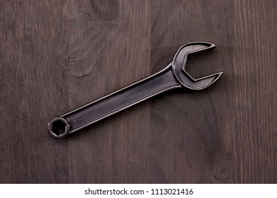 A Studio Photo Of A Wrench On An Oily Rag