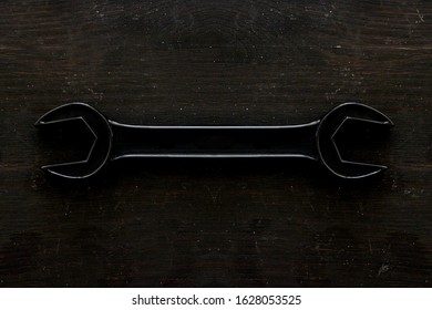 A Studio Photo Of A Wrench On An Oily Rag