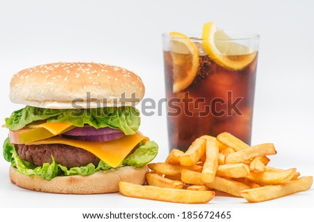 Studio photography of a hamburger with fries and a coke