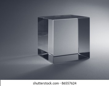 Studio Photography Of A Solid Glass Cube In Grey Back