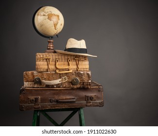 Studio Photography Of Travel Essentials. Suitcases Packed For Traveling. Prepared For Traveling. Life After Pandemic. All Over The World. Travel Concept. Exploring New Destinations. Vintage Concept.