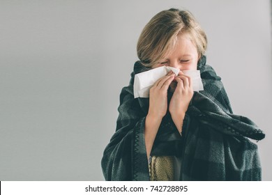 Studio Picture From A Young Girl With Handkerchief. Sick Child Isolated Has Runny Nose. Girlie Makes A Cure For The Common Cold.Nerd Is Wearing Glasses.