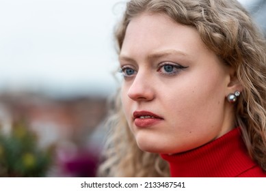 Studio Portrait Of A 21 Year Old White Blonde Woman With Curling Hair