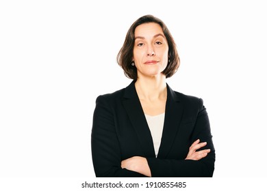 Studio Portrait Of 45 - 50 Year Old Woman Posing On White Background, Wearing Black Jacket