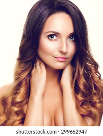 Studio Portrait Of Beautiful Model With Long Curly Ombre Hair. Close Up