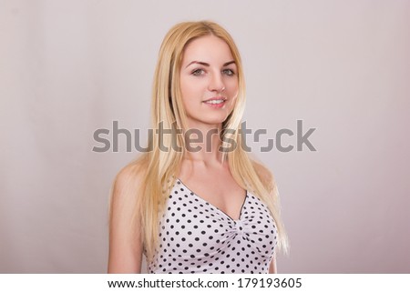 Studio portrait of a beautiful young blonde woman with natural make-up