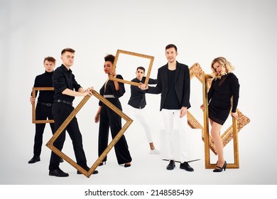 Studio Portrait Of Beautiful Young Diverse Group Of Friends Isolated On White Background In The Frame For A Picture, Goofy Face, Good Mood