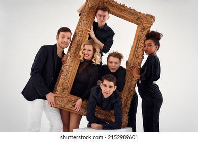 Studio Portrait Of Beautiful Young Diverse Group Of Friends Isolated On White Background In The Frame For A Picture, Goofy Face, Good Mood