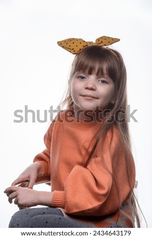 studio portrait of a charming little girl on a white background 7