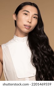 Studio Portrait Of Confident Taiwanese Transgender Woman In Her 20s On A Neutral Background