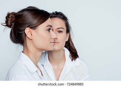 Studio Portrait Of Female Twins