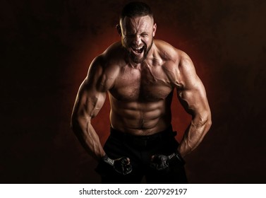 Studio portrait of fighting muscular man in black fighting gloves posing on dark background. The concept of mixed martial arts. Brutal bodybuilder energy and power boxing. - Powered by Shutterstock